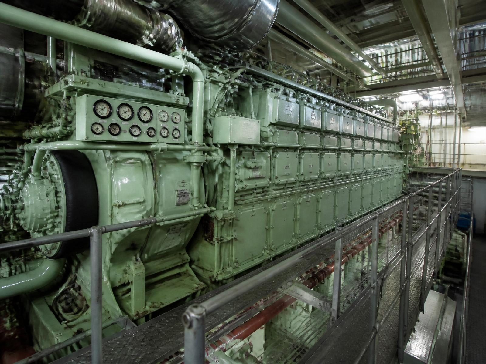 Large marine diesel engine in a ship engine room