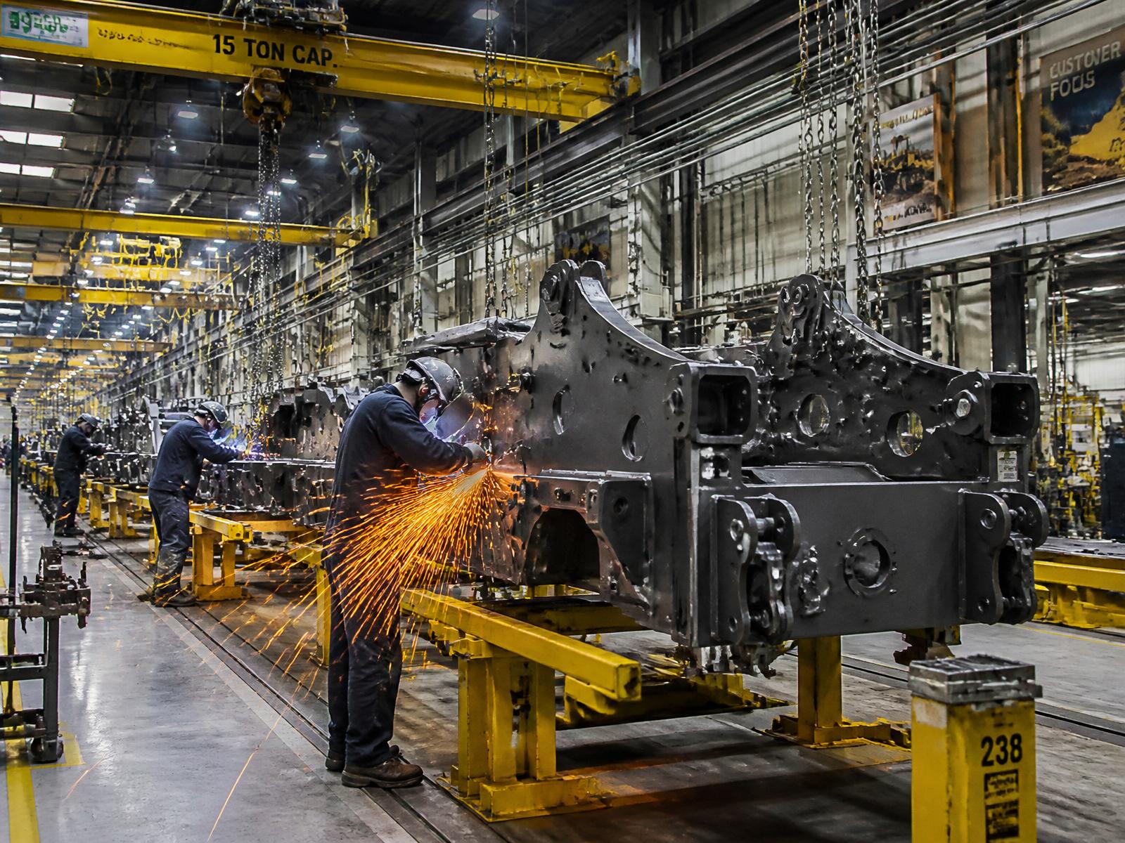 Heavy equipment frames on an OEM factory assembly line