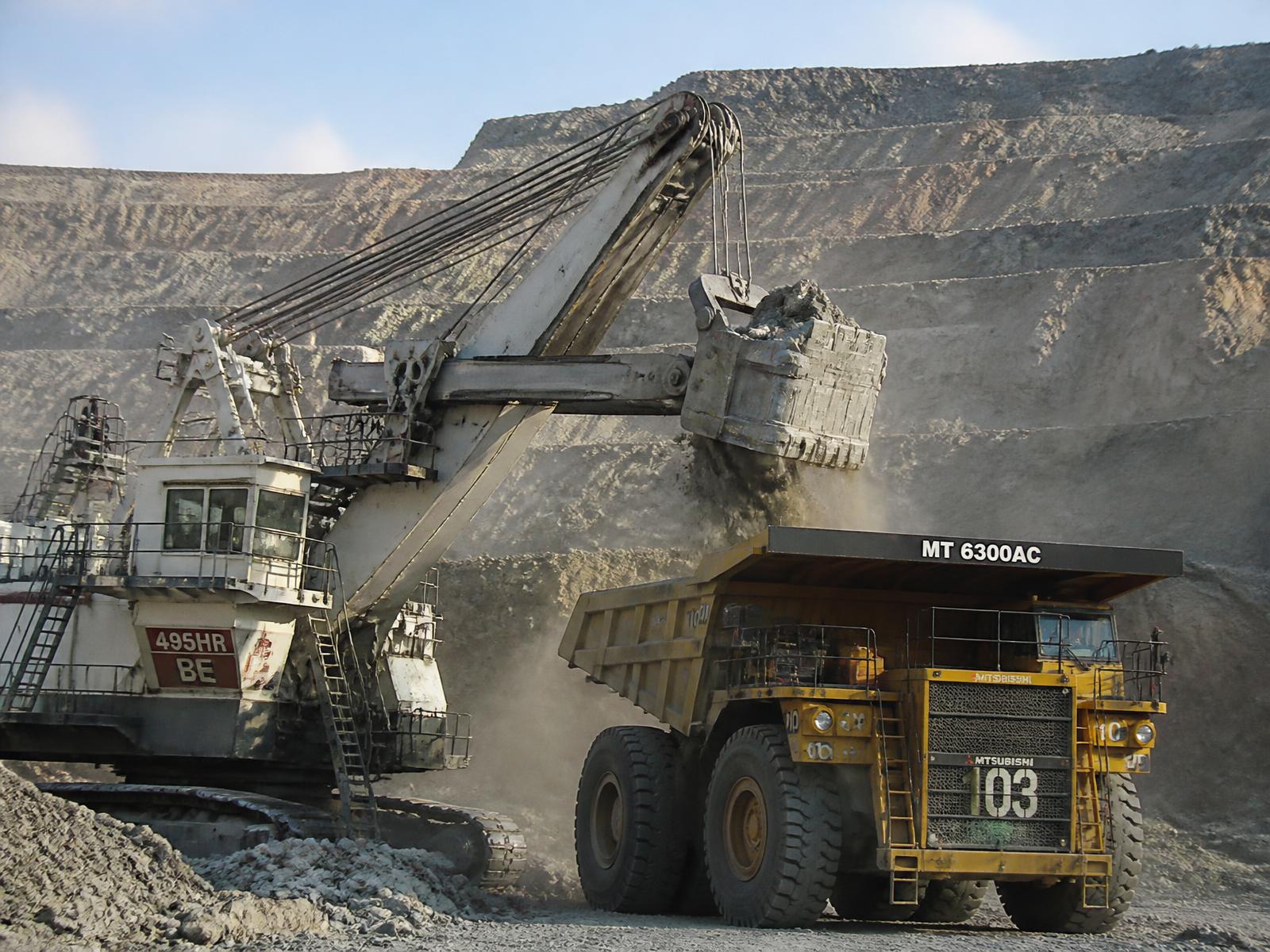 Mining shovel loading a haul truck in an open-pit mine